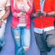 Stock photo of teenagers on phones